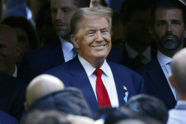 Donald Trump smiles while at a 9/11 memorial service