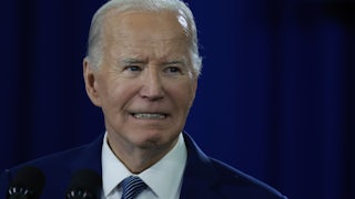 Joe Biden grits his teeth while giving a speech.