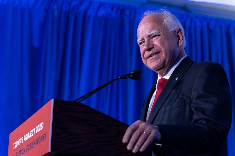 Minnesota Governor Tim Walz speaks at the podium during an event on Project 2025