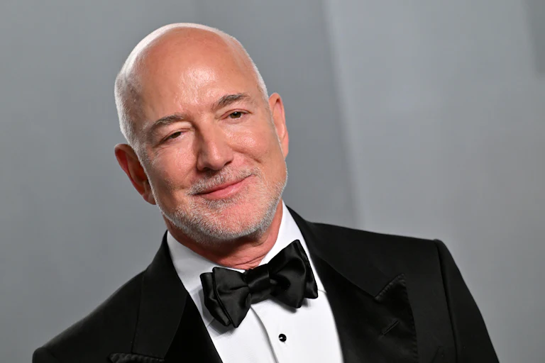 Jeff Bezos smiles while wearing a tux