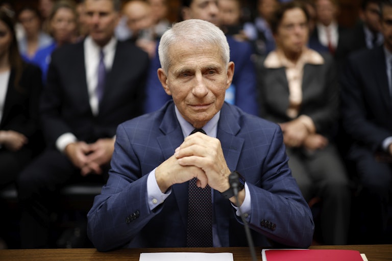 Anthony Fauci clasps his hands while testifying before Congress