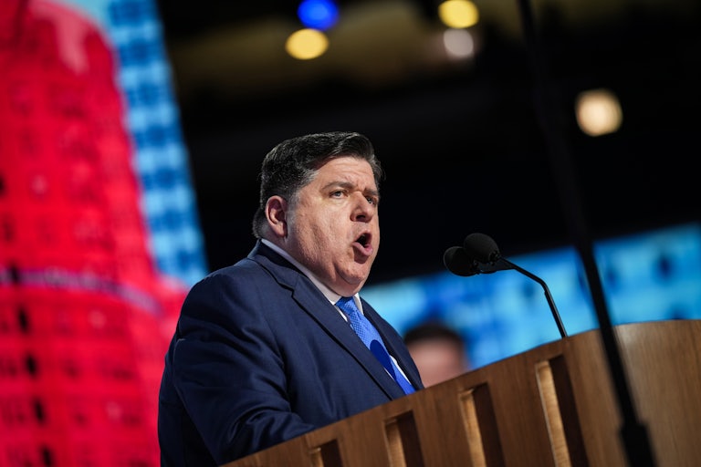 Illinois Governor JB Pritzker speaks at a lectern.
