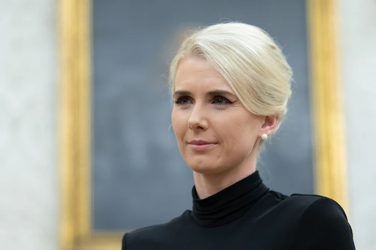 Natalie Harp stands in the Oval Office
