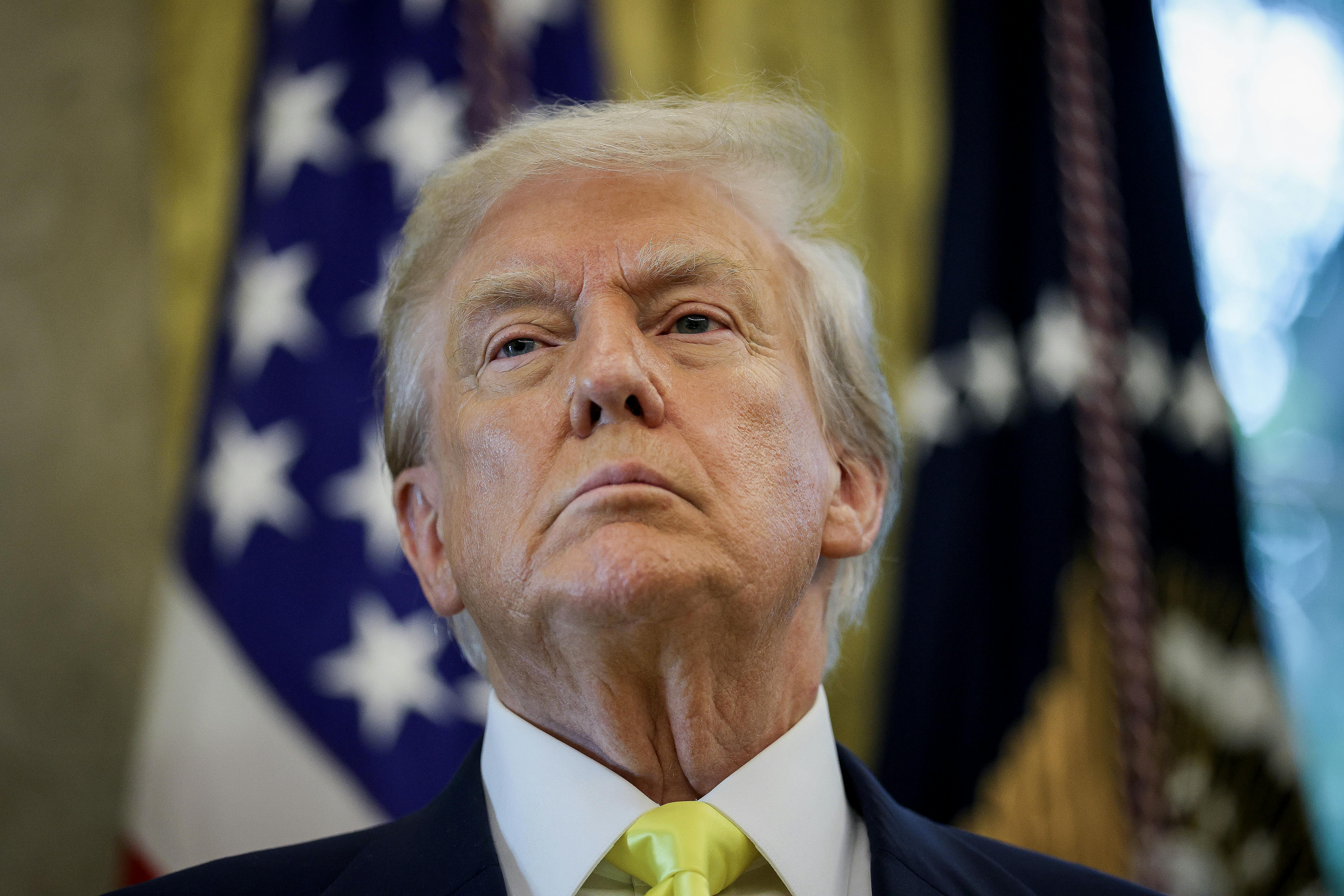 Donald Trump takes a question in the Oval Office.