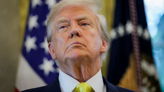 Donald Trump takes a question in the Oval Office.