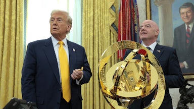 Donald Trump speaks alongside FIFA President Gianni Infantino after unveiling the 2025 Club World Cup trophy in the Oval Office at the White House.