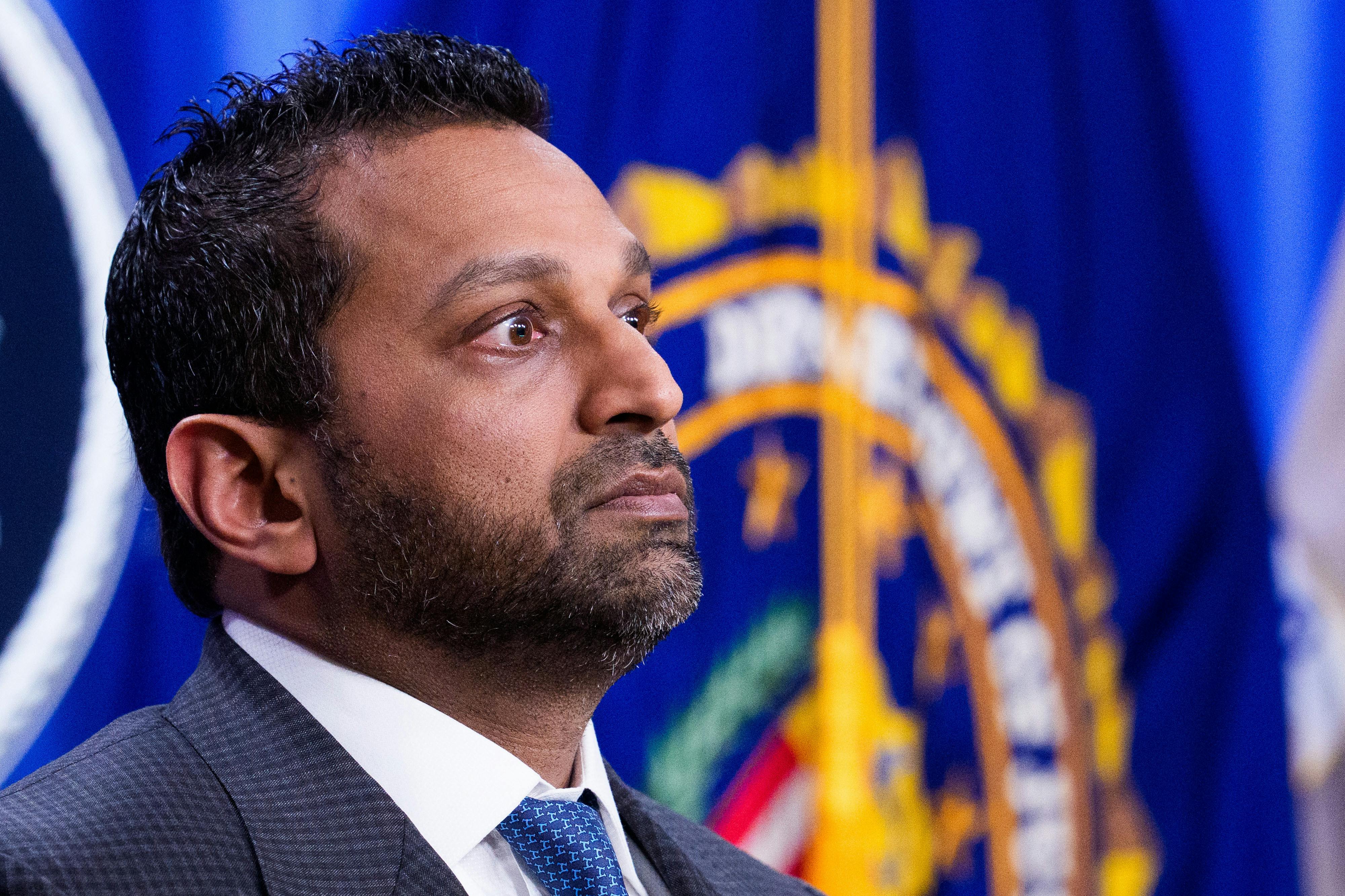 FBI Director Kash Patel stands during a press conference
