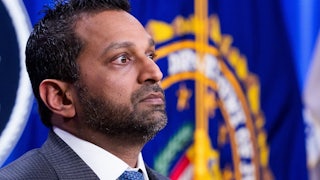 FBI Director Kash Patel stands during a press conference