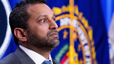 FBI Director Kash Patel stands during a press conference