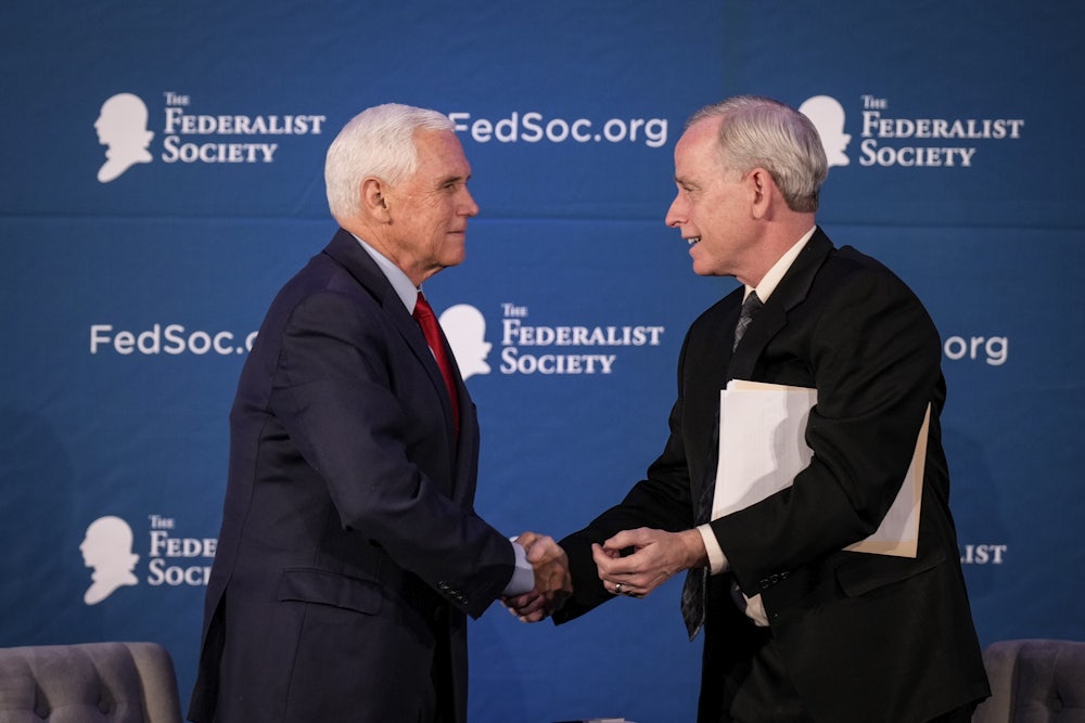 Former Vice President Mike Pence shakes hands with with Federalist Society Senior Vice President Dean Reuter in April of 2023. Reuter is one of several individuals who might be tapped to run the Federalist Society.