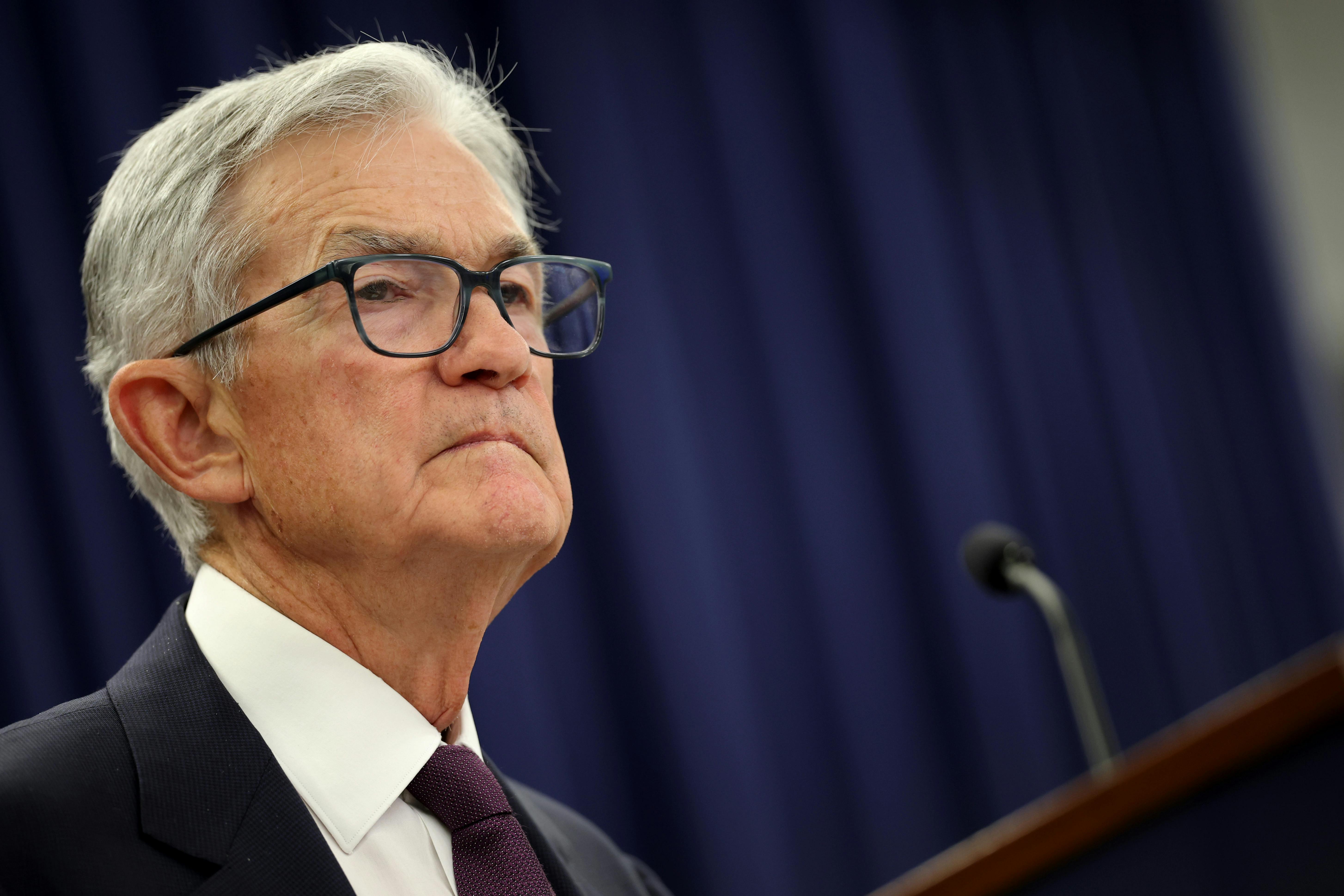 Federal Reserve Chair Jerome Powell stands at a podium
