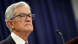 Federal Reserve Chair Jerome Powell stands at a podium