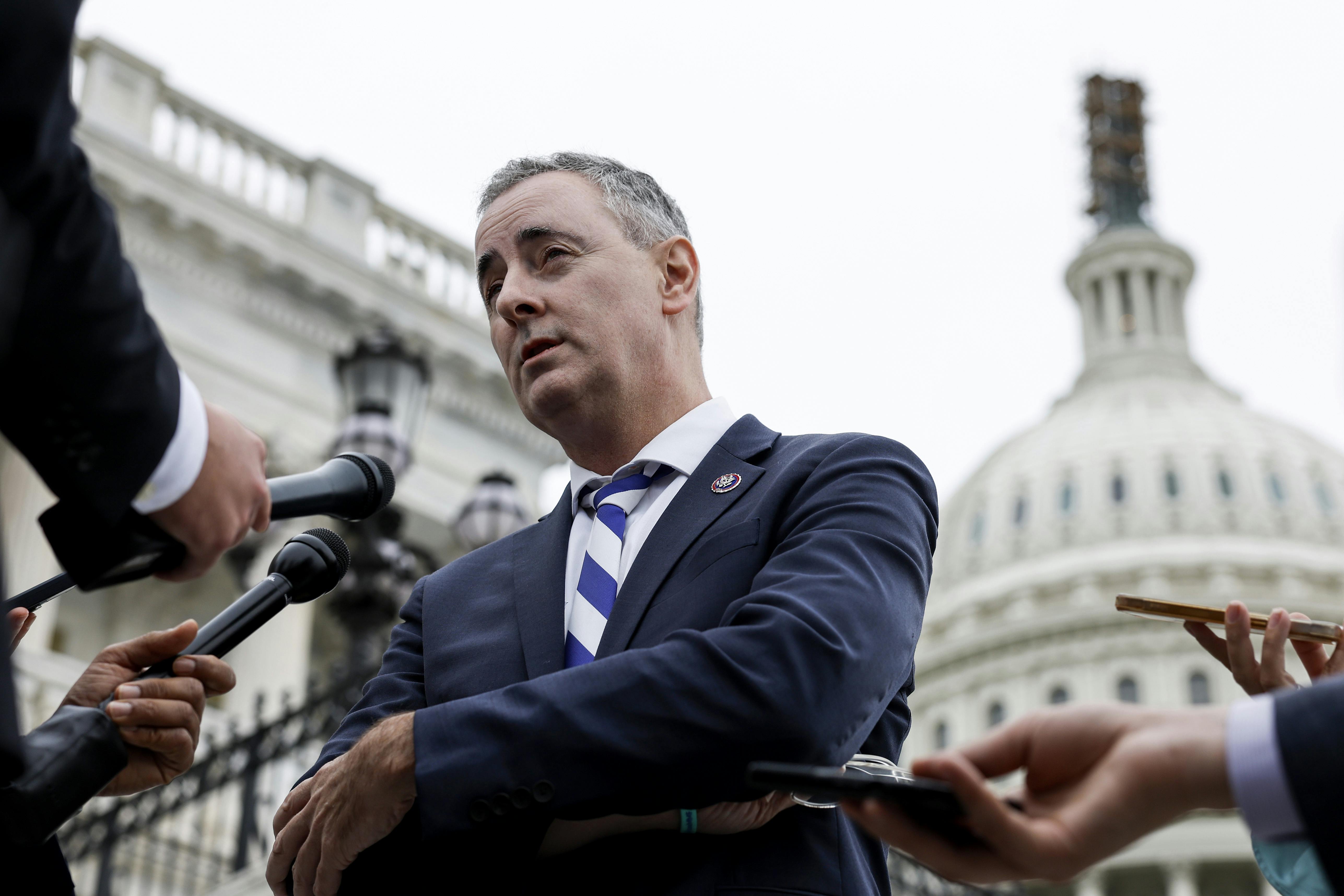 Representative Brian Fitzpatrick speaks to reporters outside the Capitol.