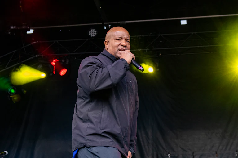 Young MC performs on stage