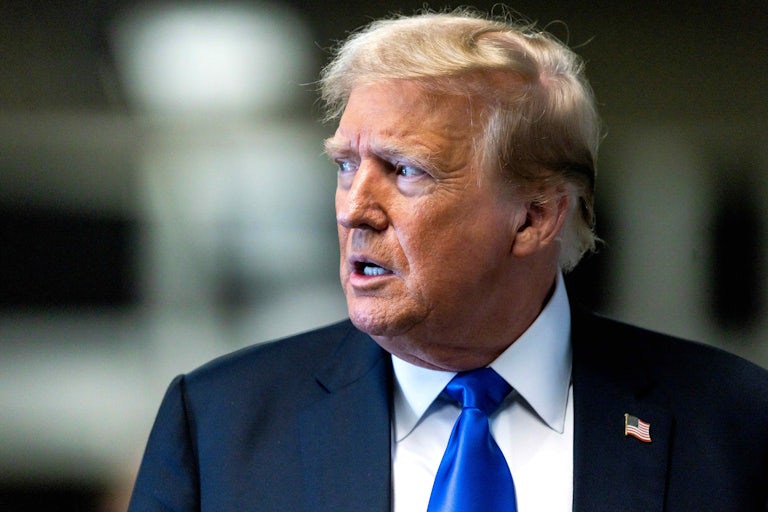 Donald Trump looks to the side concerned