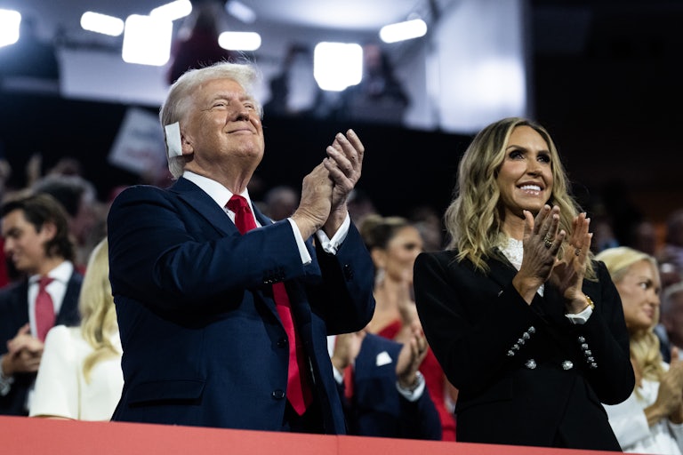 Donald Trump and his daughter-in-law, RNC co-chair Lara Trump, clap while standing next to each other