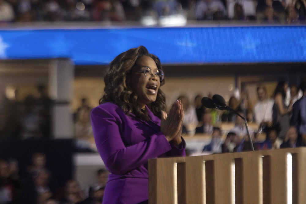 Oprah Winfrey at the podium speaking at the DNC