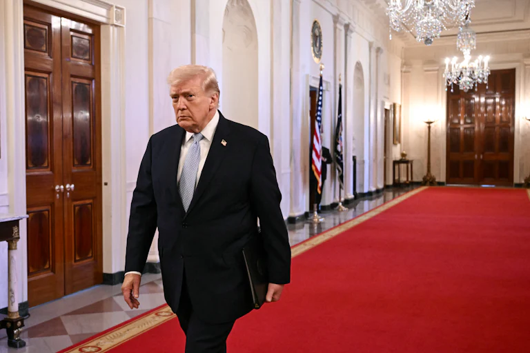 Donald Trump walks in the White House