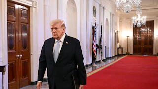 Donald Trump walks in the White House