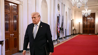Donald Trump walks in the White House