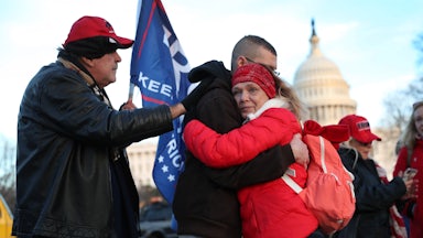 Gary Phaneuf, Tony Naples, and Melody Black visit a memorial for Ashli Babbitt near the U.S. Capitol.