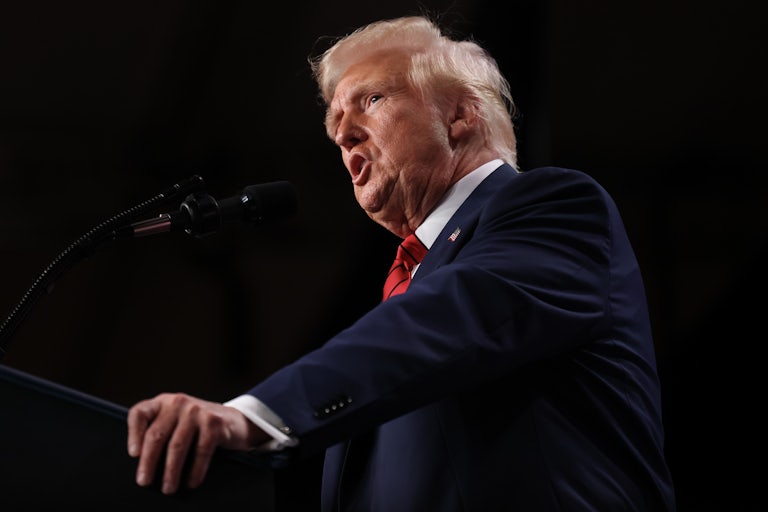 Donald Trump gives a speech at a lectern