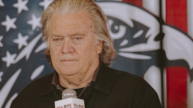 Steve Bannon holds a microphone