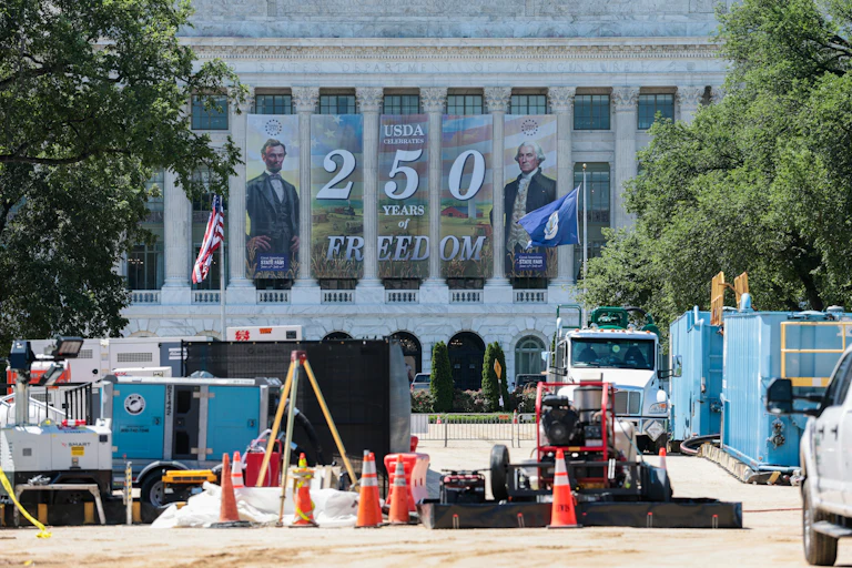 Workers build Freedom 250’s Great American State Fair on the National Mall