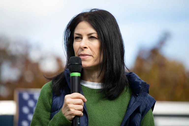 Michigan Attorney General Dana Nessel speaks into a microphone