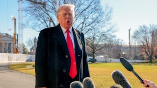 Donald Trump speaks to reporters on the White House lawn.