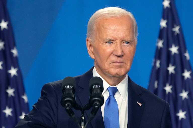 Joe Biden frowns during his press conference