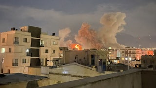 Plumes of smoke rise following reported explosions near Iran’s Ministry of Intelligence on Araqi Street in Tehran.