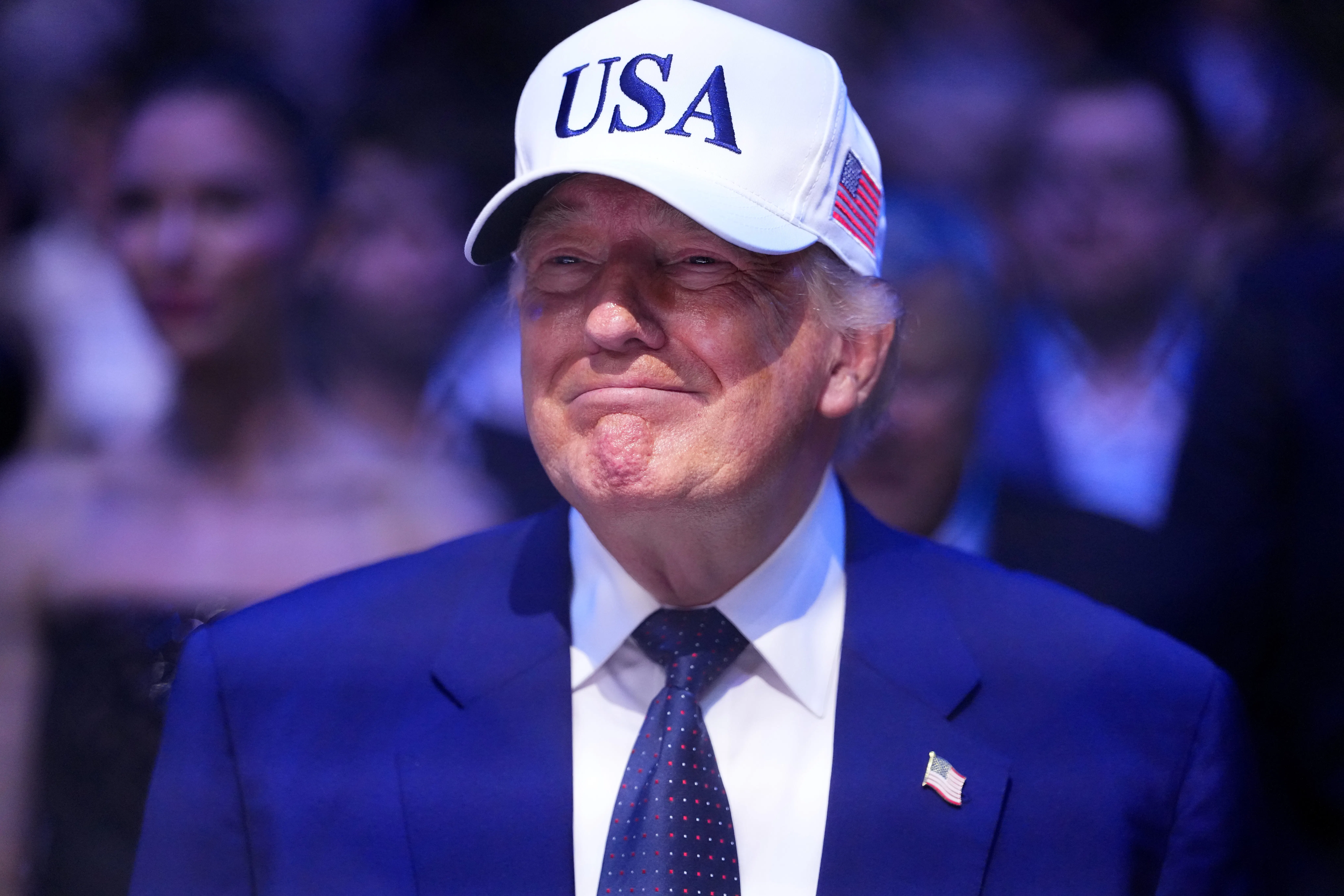 Donald Trump wearing a USA hat