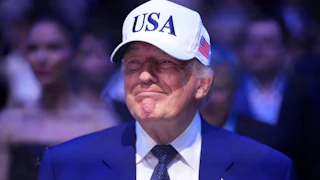 Donald Trump wearing a USA hat