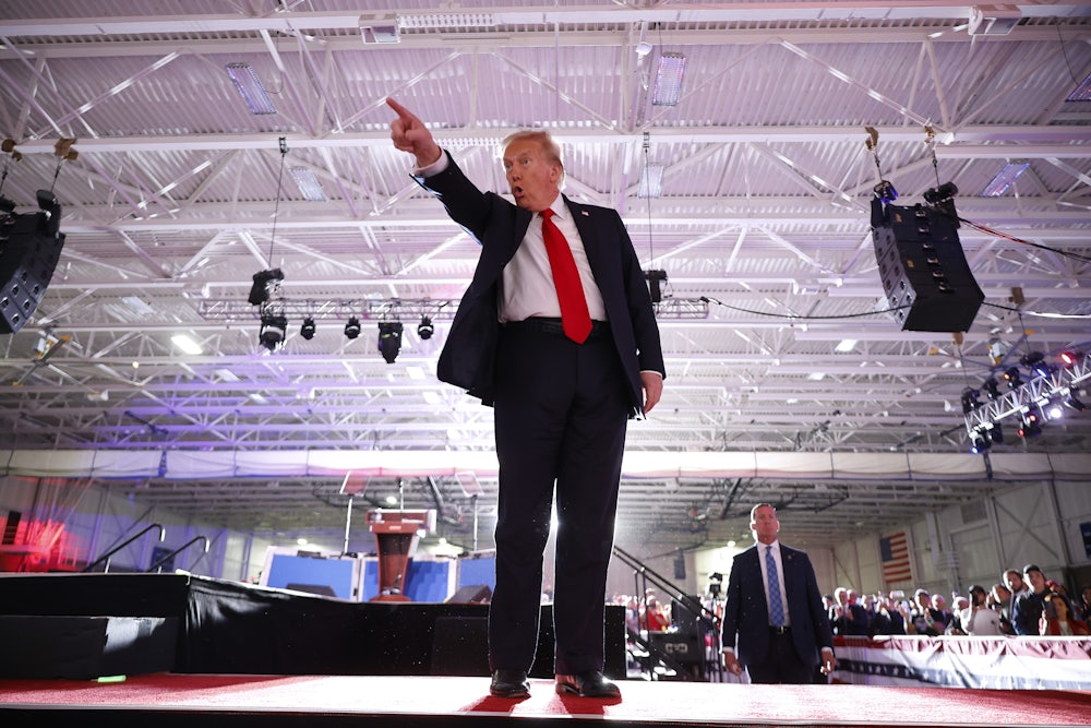 Donald Trump points enthusiastically.