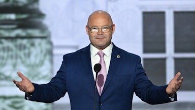 Sean O'Brien standing at a lectern.