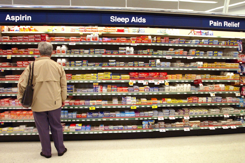 A customer shops for items in a Walgreens store