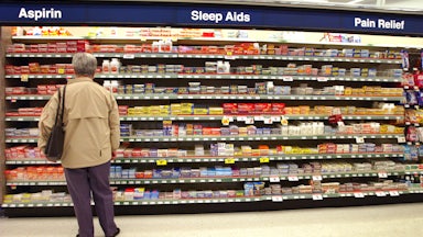 A customer shops for items in a Walgreens store