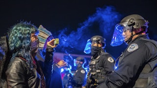 A Black Lives Matter protester films the police at an encounter in Washington state.