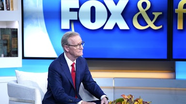Fox News host Steve Doocy sits on the set of Fox & Friends