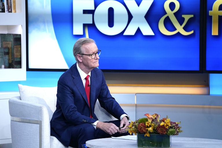 Fox News host Steve Doocy sits on the set of Fox & Friends