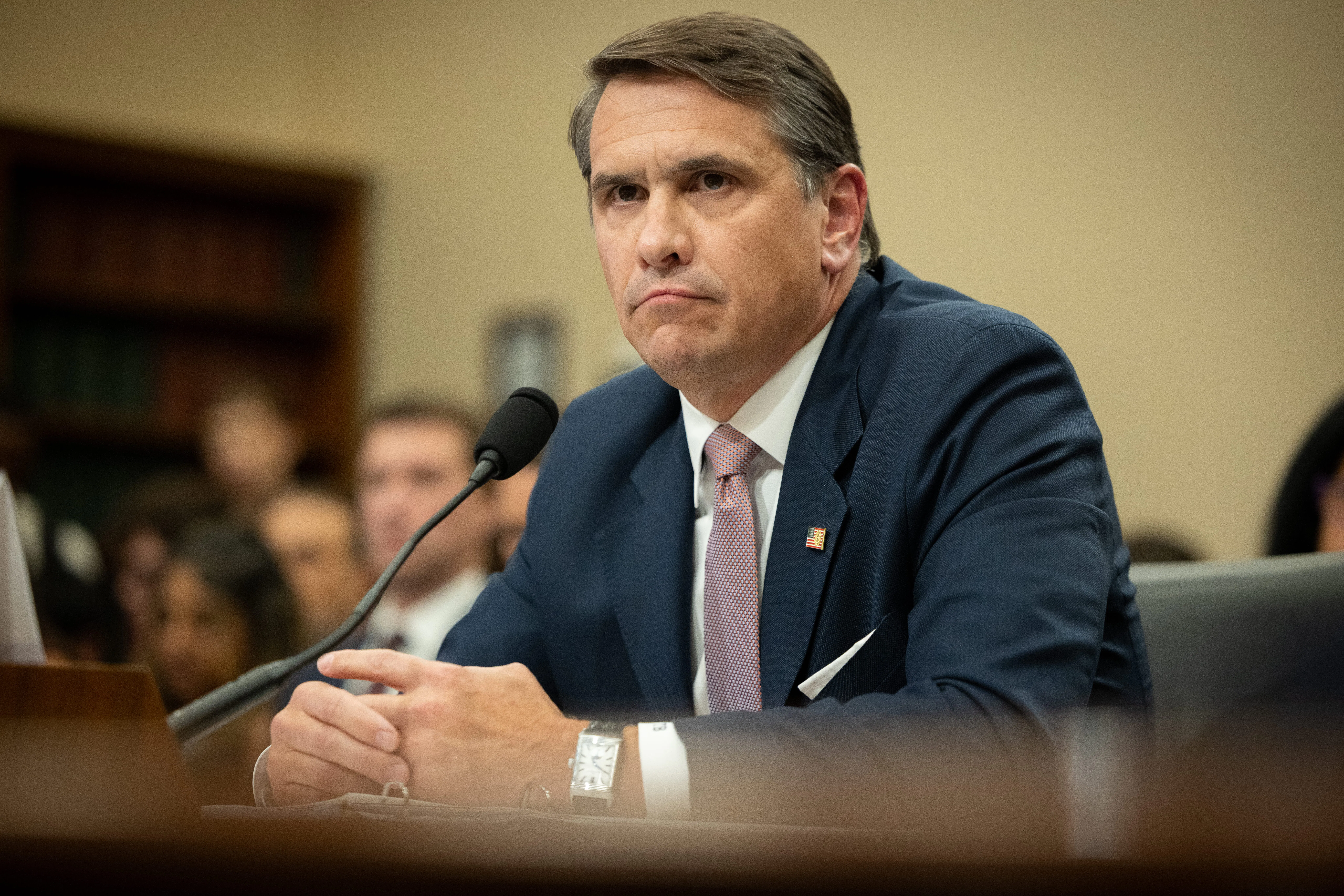 Acting Attorney General Todd Blanche sits with his hands folded during a congressional hearing