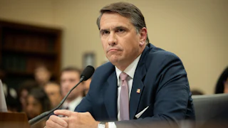 Acting Attorney General Todd Blanche sits with his hands folded during a congressional hearing
