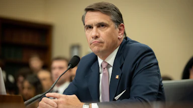 Acting Attorney General Todd Blanche sits with his hands folded during a congressional hearing