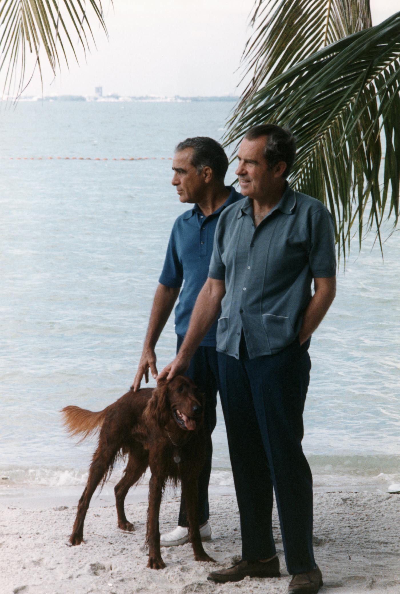 Richard Nixon with multimillionaire pal Bebe Rebozo standing on a beach in Key Biscayne, Florida, in 1971