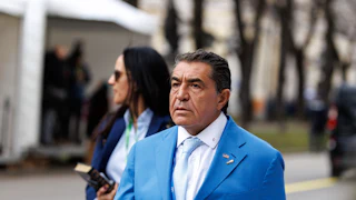 Paolo Zampolli walks at the Munich Security Conference