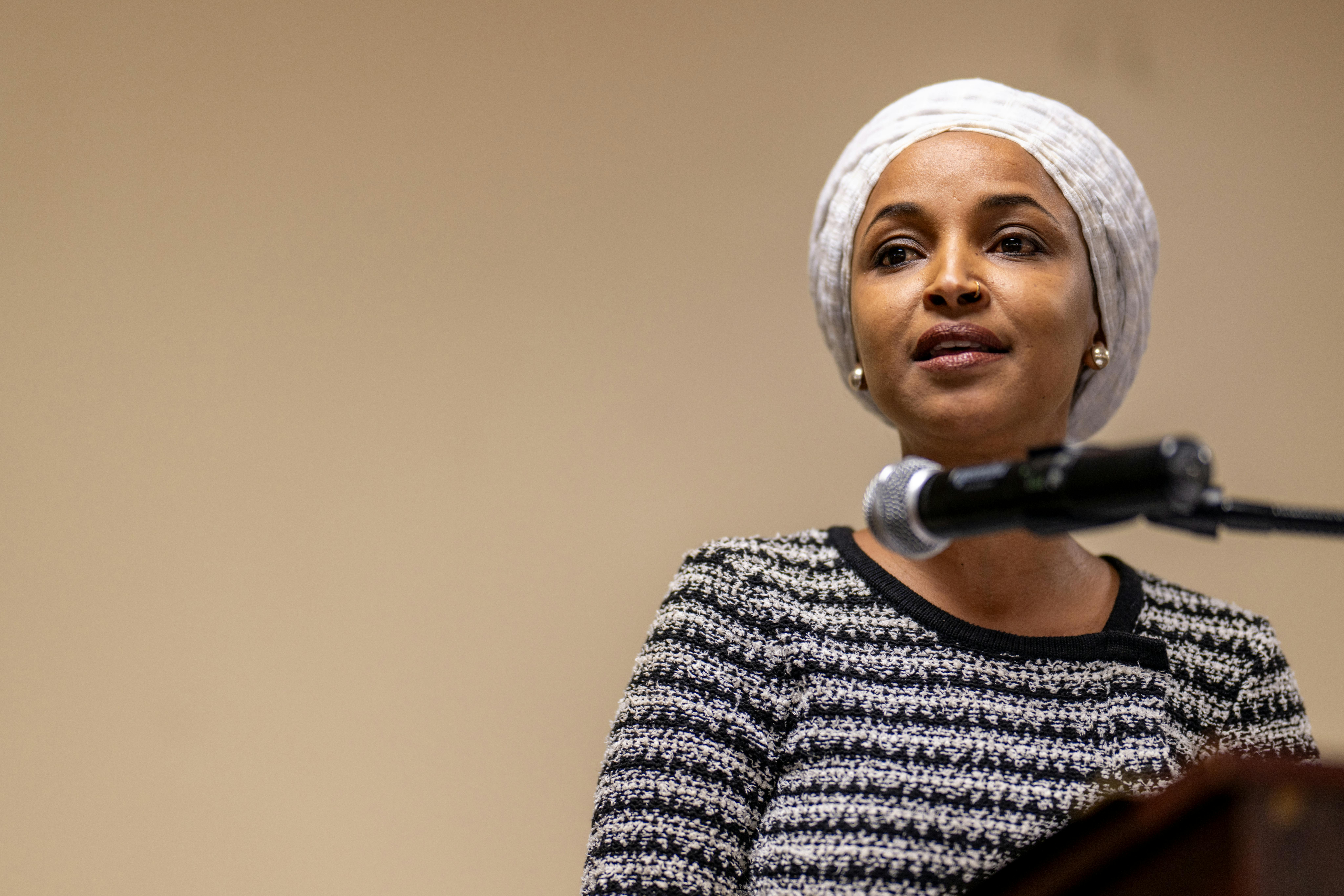 Representative Ilhan Omar speaks at the town hall where she was attacked.