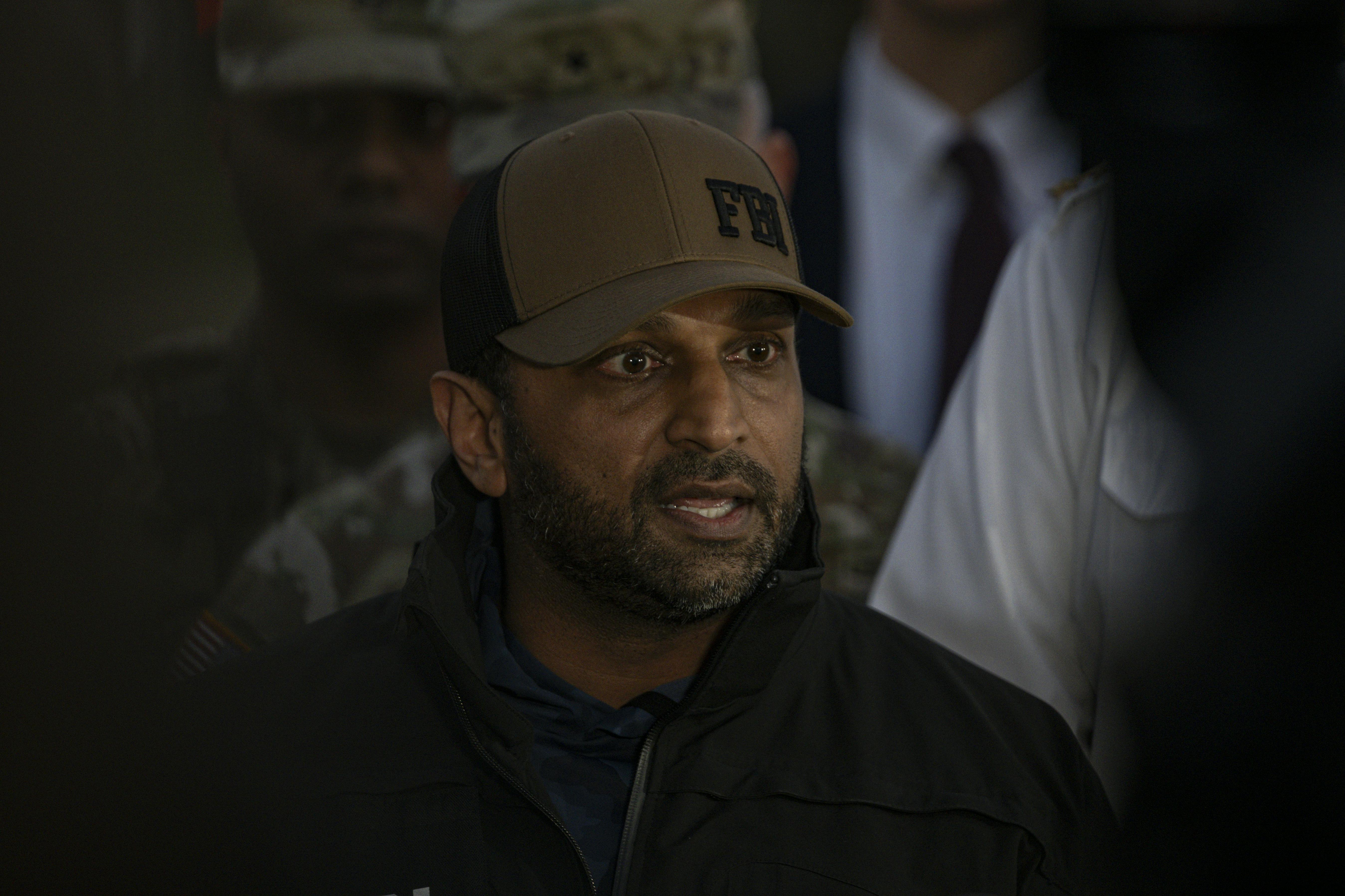 FBI Director Kash Patel speaks into a microphone