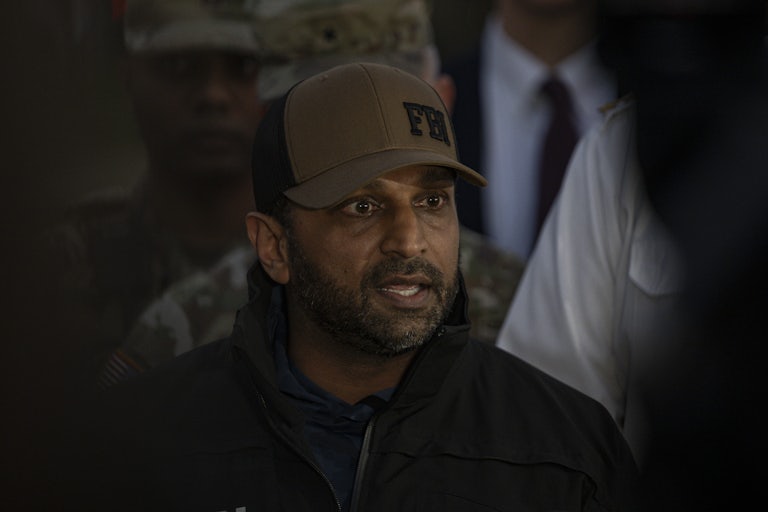 FBI Director Kash Patel speaks into a microphone