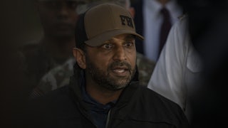 FBI Director Kash Patel speaks into a microphone